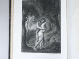 un livre ouvert sur lequel figure le dessin d'une femme nue enlacée par un homme