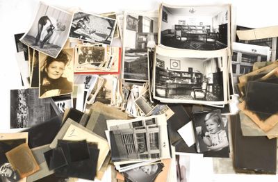 a pile of old photographs and photographs on a table