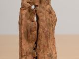 a statue of a man and a woman kissing on a table