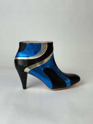 black and blue high heeled ankle boots with metallic accents