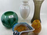 three vases that are sitting next to each other on a table