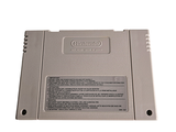 a gameboy game sitting on top of a white table