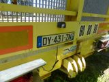 a close up of the back end of a yellow truck