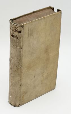 an old book sitting on top of a table next to a white background