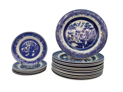 several blue and white plates are stacked on top of each other