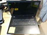 a laptop computer that is sitting on a desk
