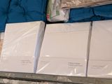 boxes of bedding are stacked on top of each other in a store