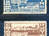 two stamps from the first world war showing a castle and a town