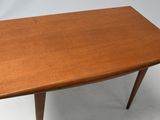 a close up of a wooden table on a white background