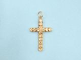 a close up of a gold cross on a blue background