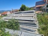 a pile of metal pipes sitting on the side of a hill