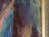un tableau représentant un cheval, encadré dans un cadre doré