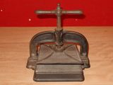 a small metal object that is on a wooden table