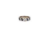 an image of a diamond and sapphire ring on a white background