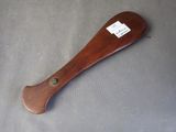 a wooden baseball bat with a tag on it