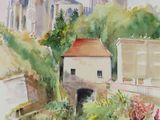 a watercolor painting of a river with buildings in the background