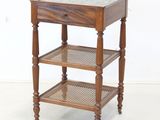 a small wooden table with a glass top on it