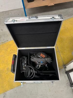 an open case with a tool in it sitting on the floor