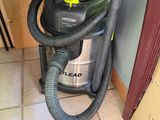 a vacuum that is sitting on the floor next to a box