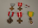 several medals and medals are displayed on a white surface