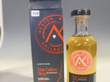 an image of a bottle of alcohol sitting next to a box