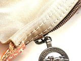 a coin that is sitting in a purse
