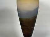 a vase that is sitting on a stand on a white surface