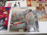 a lot of records on a table with pictures on them