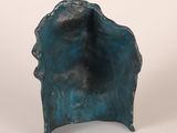 a bronze sculpture of a shell on a white background
