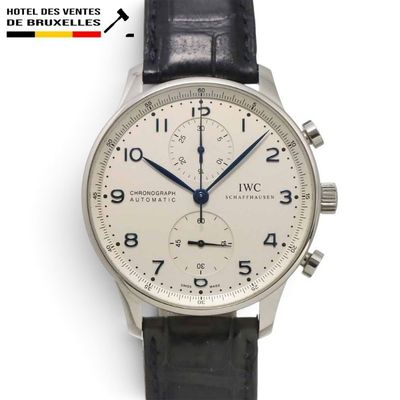 an image of a wrist watch with a white dial and black leather strap