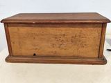 an old wooden box sitting on top of a table