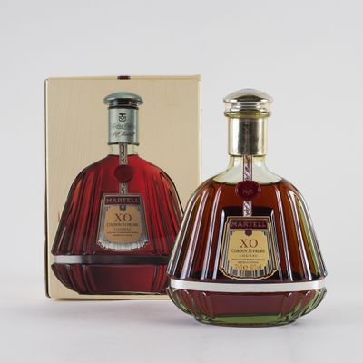 an image of a bottle of brandy sitting next to a box
