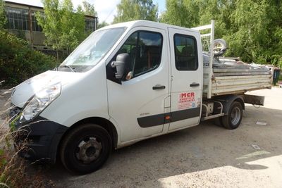 a white truck that is parked on the side of the road