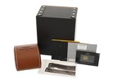 an image of a black box with a watch and a brown leather case