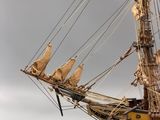 a model of a ship on display on the water