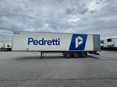 a picture of a semi trailer parked in a parking lot