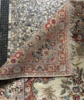 an image of a close up of a rug on a tiled floor