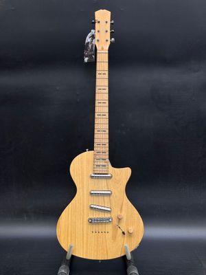an electric guitar with a wooden body on a black background