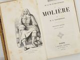 an open book with a drawing of a man sitting on a chair