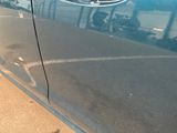a close up of a car door with a sticker on it