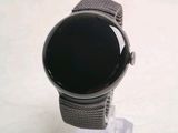 a watch that is sitting on top of a stand