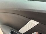 a close up of a door handle in a car