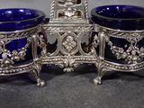 three blue glass bowls sitting next to each other on a table