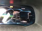 a picture of a car ' s dashboard with a digital display