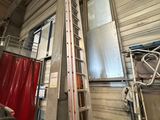 a ladder that is next to a window in a building