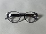 the glasses are made of plastic and have a clear lens