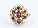 an image of a gold ring with garnets and garnets on it