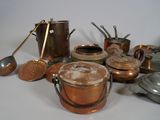 many pots and pans that are sitting on a table