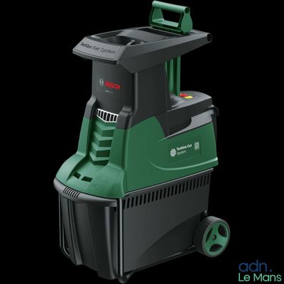 a close up of a green and black cleaning machine on a black background