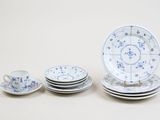 a group of plates and cups sitting on a table